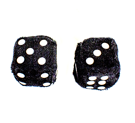 Two black fluffy dice with white spots showing numbers five and three.